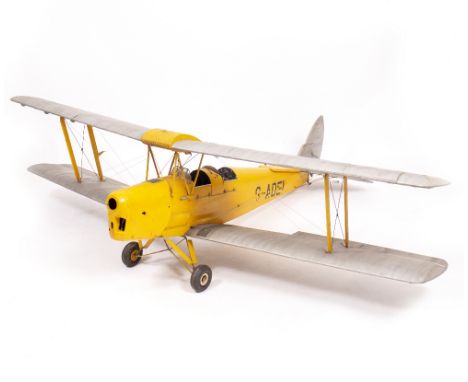 A FLYING SCALE MODEL OF A BI-PLANE painted in yellow and silver, numbered G-AOEI, approximately 200cm wide wingspan 