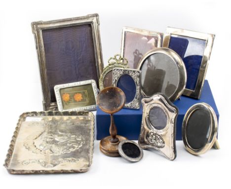 A COLLECTION OF SILVER AND SILVER PLATED PHOTO FRAMES gilt metal photo frames and a silver plated tray with embossed decorati