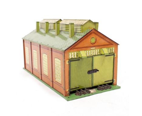 A HORNBY 'O' GAUGE TIN PLATE ENGINE SHED with twin doors to either end, 49.5cm long together with a platform, further platfor