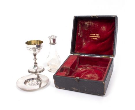 A SILVER TRAVELLING COMMUNION SET  consisting of a paten, a cup and a flask, bearing marks for London with a indistinct maker