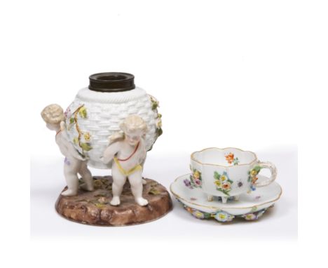 A CONTINENTAL PORCELAIN TEACUP AND SAUCER with blue, possibly Meissen mark to the base decorated with insects and flowers, an