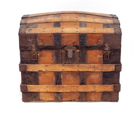 AN EARLY 20TH CENTURY IRON BOUND DOME TOPPED TRUNK  71cm wide x 44cm deep x 67cm high 