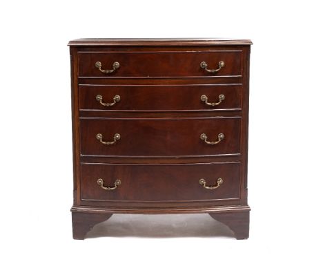 A REPRODUCTION MAHOGANY BOW FRONTED CHEST OF FOUR LONG DRAWERS with bracket feet, 69cm wide x 44.5cm deep x 77cm high