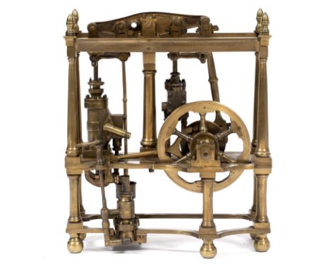 AN EARLY TO MID 20TH CENTURY BRASS SCALE MODEL STEAM BEAM ENGINE with acorn finials to the frame with turned column supports,