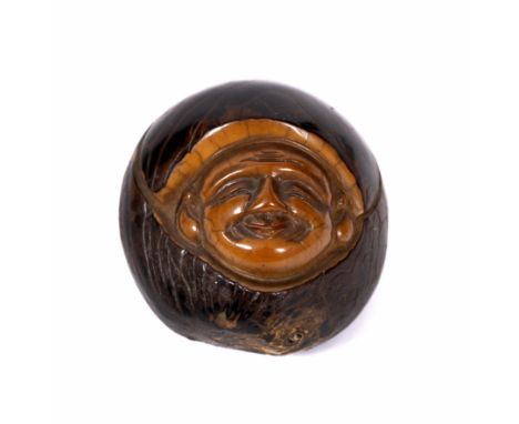 A JAPANESE CARVED NUT NETSUKE  of Daruma and signed to the base 4.5cm wide