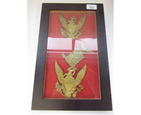 Three US military civil war style brass shako hat badges to include a 65th Excelsior.  Mounted in glazed frame. 