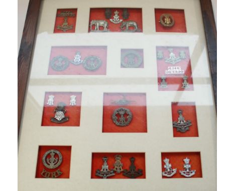 Collection of Green Howards (Princess of Wales Own Yorkshire Regt) cap badges of varying ages (some restrikes), a WWI period 