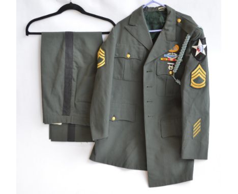 US Army dress uniform with various badges and insignia inc. MSG rank patch, pistol expert badge, combat infantry badge etc. (
