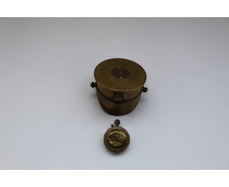 WWI trench art shell case in the form of a soldiers peaked cap, trench art lighter made from large brass nut and coin (2) 