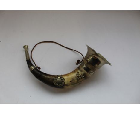 Large hunting horn made from cows horn with metal trumpet and mouthpiece, with two badges 