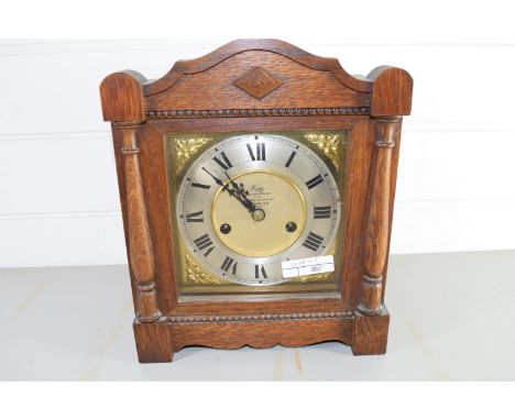 OAK MANTEL CLOCK WITH GILT DIAL WITH ROMAN NUMERALS