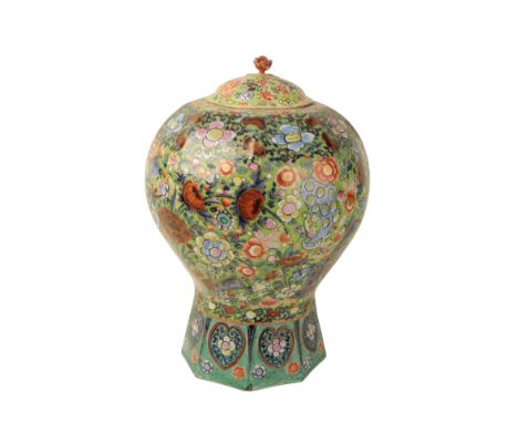 A DUTCH DELFTWARE LIDDED VASE 18th century, of octagonal baluster shape, the polychrome ground decorated with peacocks and fl