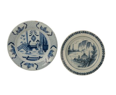 A DUTCH DELFTWARE CHARGER circa 1680, decorated in the Chinese transitional 'Kraak style', with two women in the interior; an