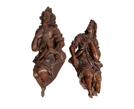 TWO CARVED OAK FEMALE FIGURES, PROBABLY ANGELS possibly Flemish, second half 17th century, each depicted with one arm raised 