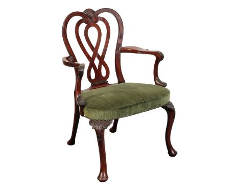 A GEORGE II MAHOGANY ARMCHAIR mid-18th century, the arched interlaced back with serpentine arms above a padded seat covered i