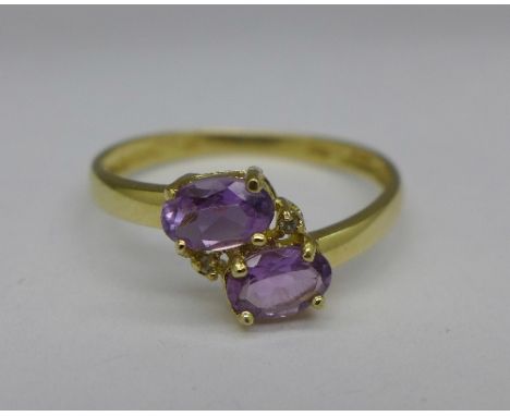 A 9ct gold, amethyst and diamond ring, 1.1g, O