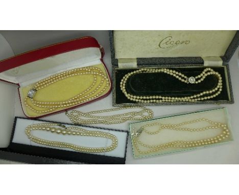 Five faux pearl necklaces
