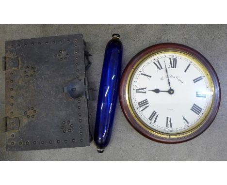 A Bristol blue glass rolling pin, a circular wall clock and a metal box in the form of an old door lock