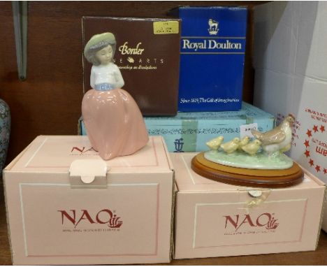 A Lladro figure, a/f, two Nao figures, a Royal Doulton figure, Marie HN1370, and a Border Fine Arts figure, Wise Cat, all box