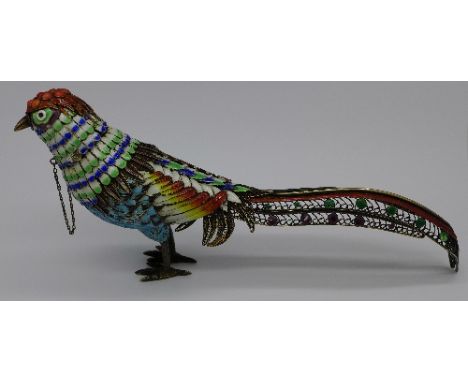 A silver and enamel decorated bird marked .925 silver, the head/top set with coral, length 18cm
