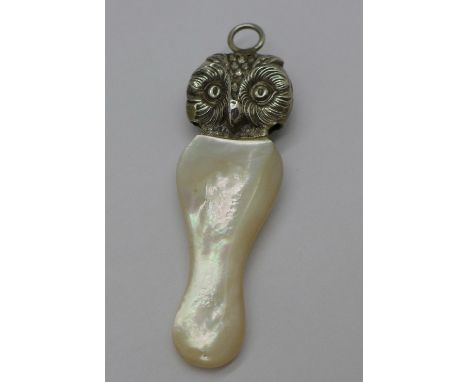 An unusual silver and mother of pearl teether and rattle in the form of an owl, with double sided head of an owl, hallmarked 