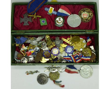 A collection of enamel and other badges and medallions