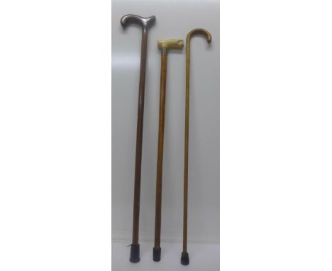 A silver mounted malacca walking stick with ivory handle, a/f, and two other walking sticks