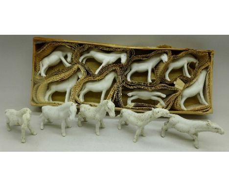 A collection of bisque model horses, boxed