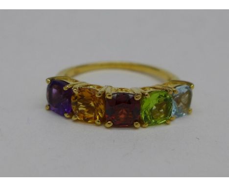 A silver gilt, peridot, topaz, garnet, citrine and amethyst ring, P