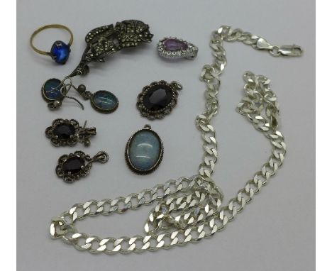 A silver chain, an opal set pendant, two other pendants, two pairs of earrings, a ring and a brooch lacking pin