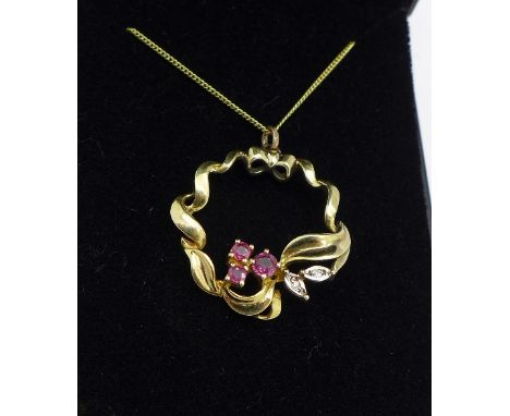A 9ct gold, ruby and diamond pendant with chain, weight of pendant 3g