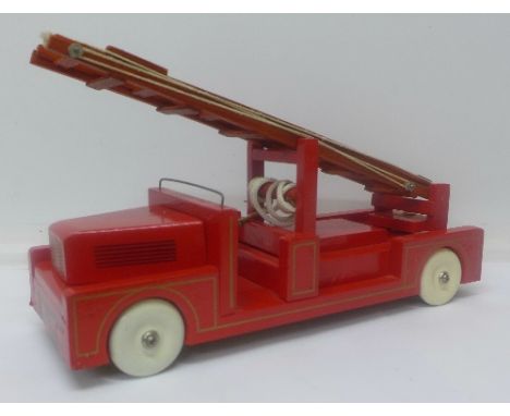 A wooden toy fire engine with tin plate wheels, marked Golden Arrow, c.1948, boxed, 35.5cm