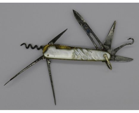 A German mother of pearl, brass and gun metal pen knife compactum by JA Henckels, with eight tools