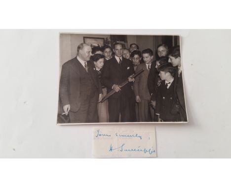 CRICKET, signed piece by Herbert Sutcliffe (3.75 x 14.75) &amp; photo showing him with bat &amp; pen with group of boys, VG, 