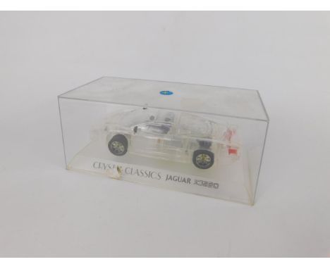 A Crystal Classics scale model of a Jaguar XJ220, boxed.