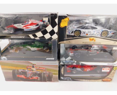 Four Mattel Hot Wheels die cast racing cars, scale 1:18, limited edition, comprising Fiat, Sakhir Bahrain, McLaren, Kimi Raik