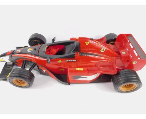 Action Man figures and accessories, including a Jeep, submersible, arm gun, paraglider, hovercraft, and a Formula 1 racing ca