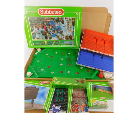 A Subbuteo table soccer boxed set, Manchester United and Liverpool teams, score board, two goalkeepers, balls and fencing, bo