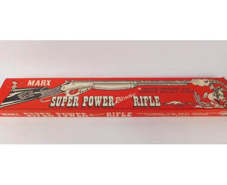 A Marx Toys Super Ricochet Rifle, bangs-smokes, has genuine bullet whine, by Louis Marx & Co Ltd, Swansea, boxed.