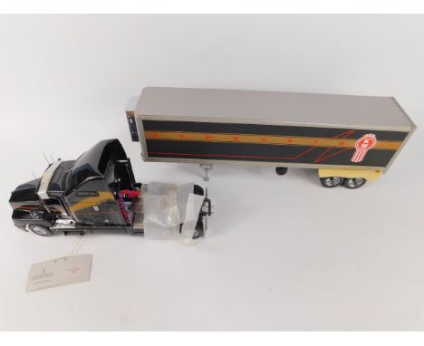 A Franklin Mint die cast model of a 1997 Kenworth T600, scale 1:32, boxed.
