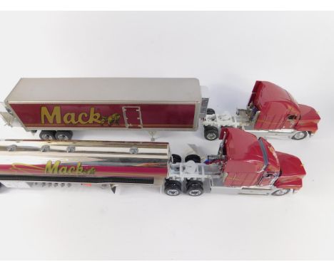 Two Franklin Mint die cast models of 1993 Mack Trucks, scale 1:32, together with a Mack Trailer and Tanker Trailer.