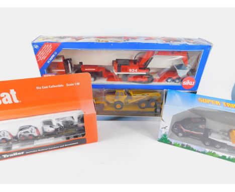 Four die cast heavy haulage models, scale 1:50, boxed, comprising Sika Transporter, Max Goll with Crane, Cararama Transporter