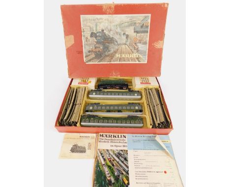 A Marklin dublo gauge train set, BET800 electric overhead engine, three coaches, track and signalling, boxed.