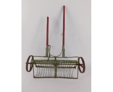 A wooden and iron scale model of a horse drawn plough, 51cm long.