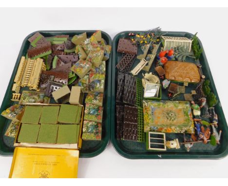 A Britains lead garden set, comprising a thatched shelter, glass house, rockeries, borders, balustrade, lawn, planting sectio