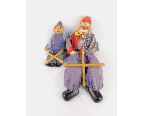 A Grove International wooden clown puppet, and a Discoverie puppet, (2).
