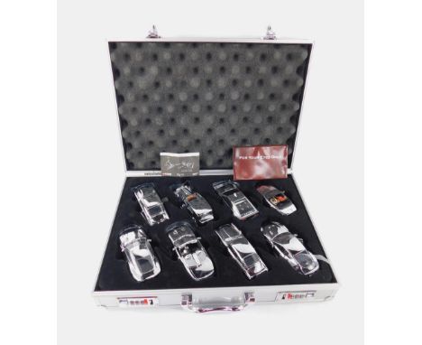 A Corgi die cast 007 set of eight silver metal cars, comprising 1996 BMW Z3, Aston Martin DBS, Jaguar XKR, Aston Martin V12 V