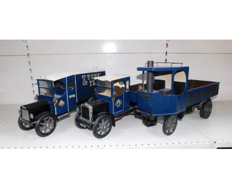 Three wooden scratch built models of Lyons Tea vintage delivery vehicles, comprising a Ford open truck, two ton closed truck 