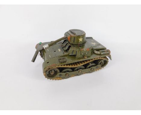 A Gama tin plate clockwork tank, circa 1937, army green with rubber tracks, with key.