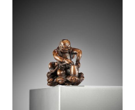 NANMUSAI: A RARE WOOD NETSUKE OF RAIJIN DISCHARGING A STORMBy Nanmusai, signed Nanmusai南無齋Japan, 19th century, Edo period (16
